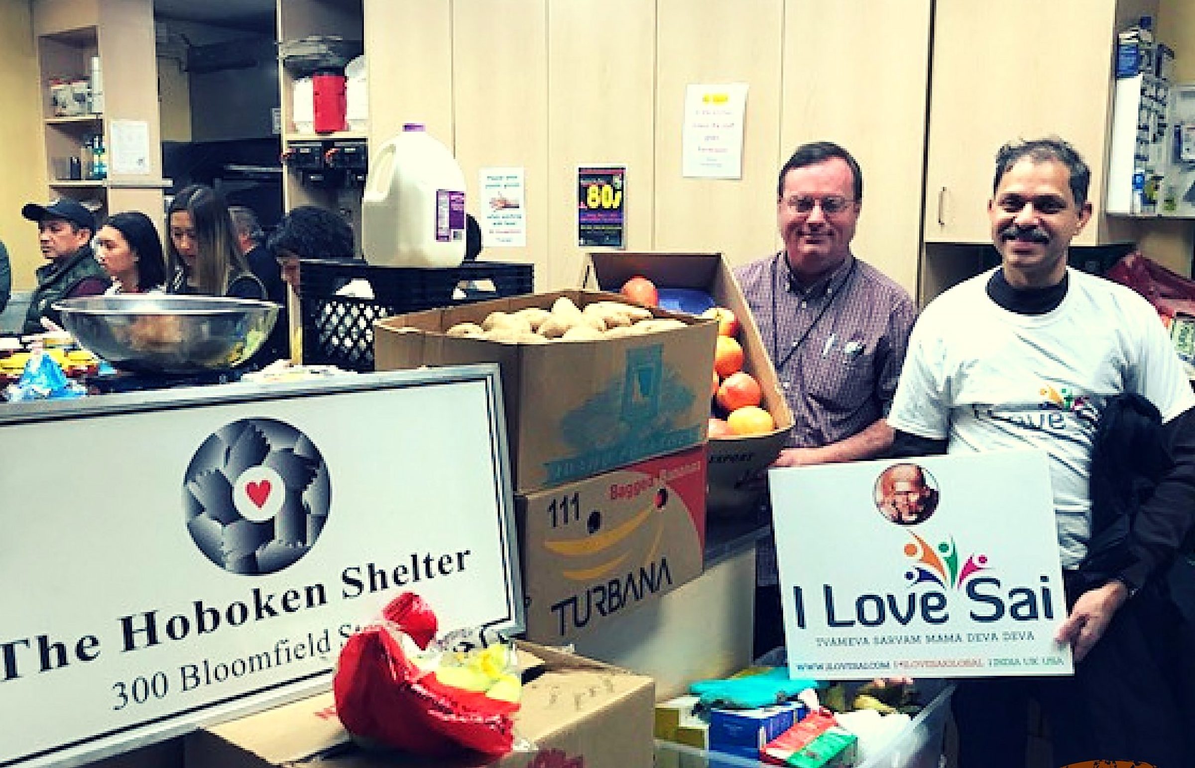 I Love Sai volunteers and shelter staff with donated food at The Hoboken Shelter